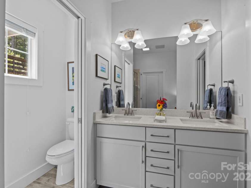 5 Meeting Street, Asheville, NC 28803.  MLS# CAR4298172, YatesRealty ID 10. Primary bathroom with double vanity
