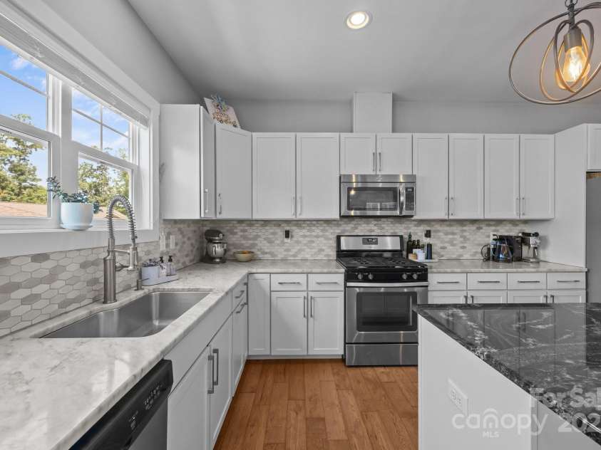 5 Meeting Street, Asheville, NC 28803.  MLS# CAR4298172, YatesRealty ID 10. Stainless appliances