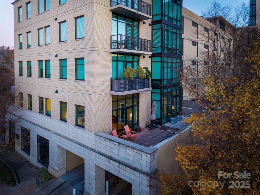 60 Market Street, Asheville, NC 28801.  MLS# CAR4321764, YatesRealty ID 1000. Massive west-facing terrace off primary suite