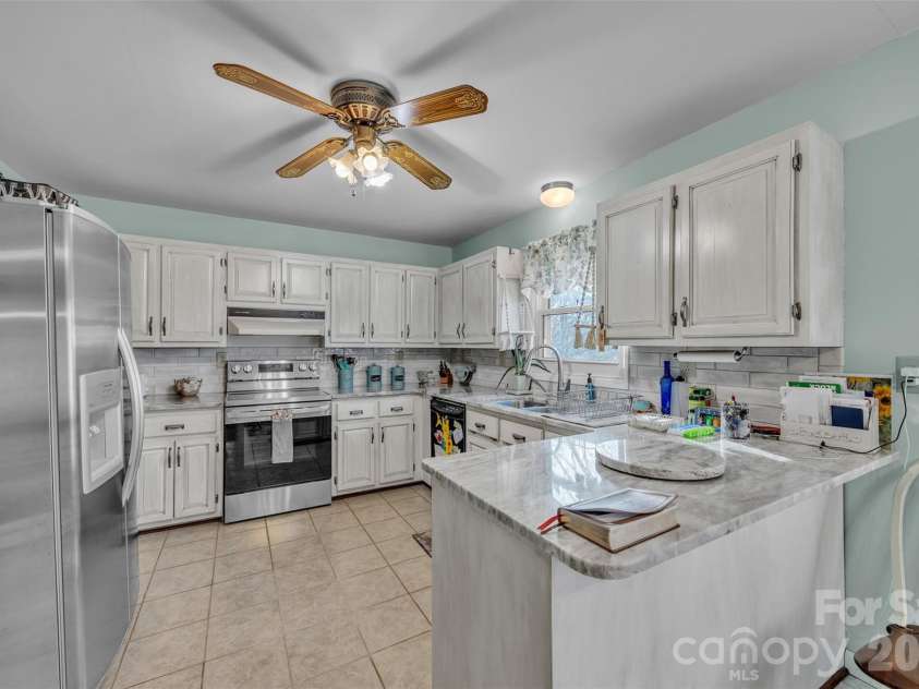 15 Mull Drive, Taylorsville, NC 28681.  MLS# CAR4333545, YatesRealty ID 10004. Kitchen has been updated with granite countertops.