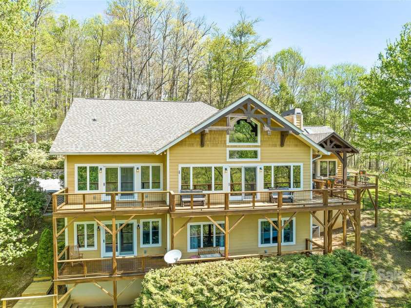 79 Cranberry Lane, Waynesville, NC 28785.  MLS# CAR4245690, YatesRealty ID 10010. Back of house shows it'sgrandeur