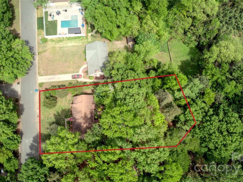 10708 Danesway Lane, Cornelius, NC 28031.  MLS# CAR4247970, YatesRealty ID 10017. Approx. 0.45 acre private lot in the heart of downtown Cornelius