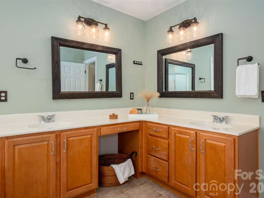 2549 Harlington Lane, Charlotte, NC 28270.  MLS# CAR4366037, YatesRealty ID 10018. Double vanities with updates include mirrors, lighting, towel holders, etc.