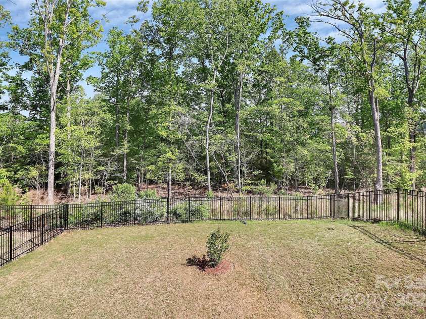 805 Deep River Way, Waxhaw, NC 28173.  MLS# CAR4224589, YatesRealty ID 10021. Private Backyard
