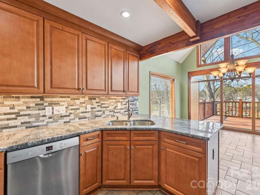 6880 Shade Tree Lane, Sherrills Ford, NC 28673.  MLS# CAR4352839, YatesRealty ID 10025. Granite countertops and tile backsplash