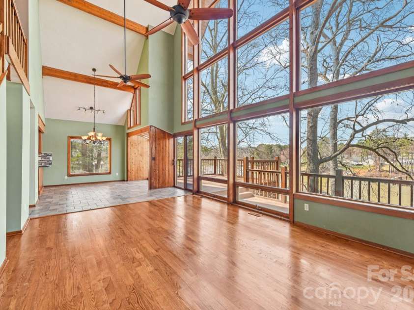 6880 Shade Tree Lane, Sherrills Ford, NC 28673.  MLS# CAR4352839, YatesRealty ID 10025. Living and dining overlook lake