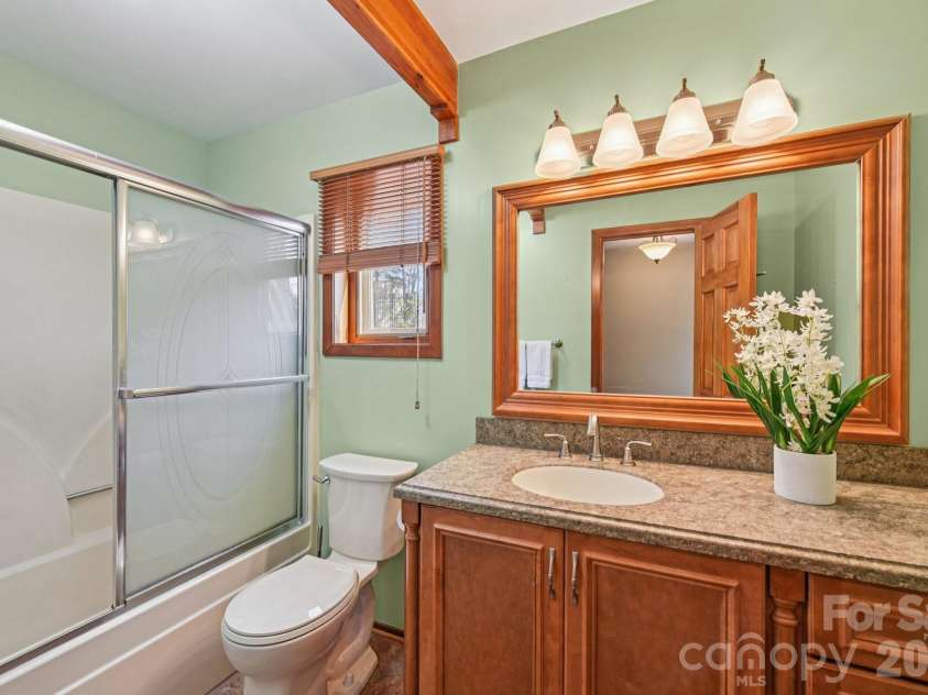 6880 Shade Tree Lane, Sherrills Ford, NC 28673.  MLS# CAR4352839, YatesRealty ID 10025. Main floor full bathroom has been updated