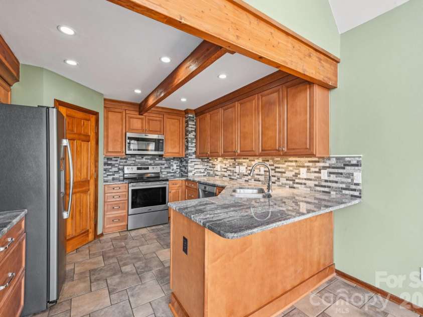 6880 Shade Tree Lane, Sherrills Ford, NC 28673.  MLS# CAR4352839, YatesRealty ID 10025. Remodeled kitchen with stainless appliances