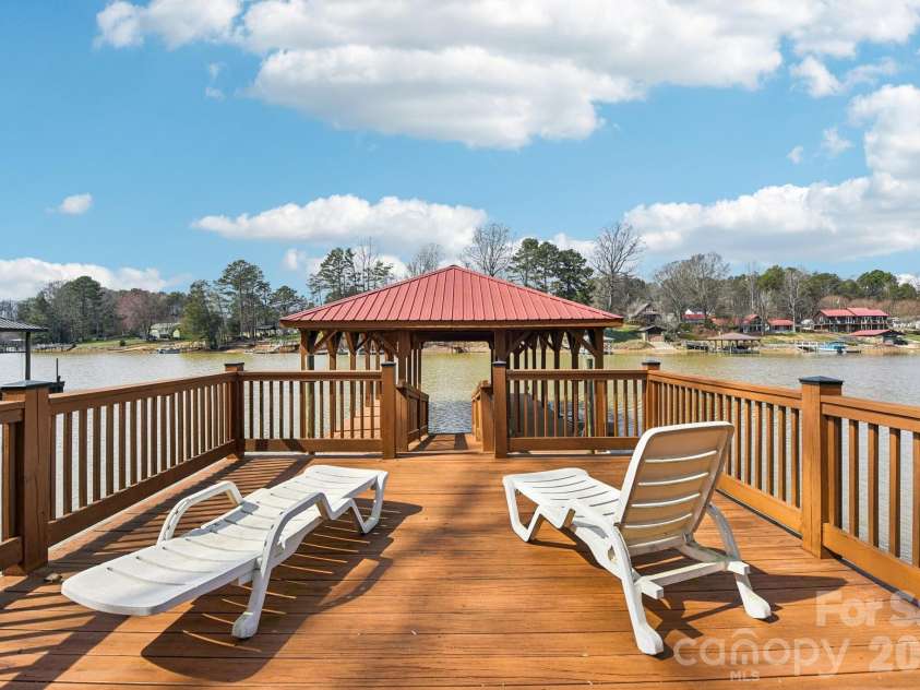 6880 Shade Tree Lane, Sherrills Ford, NC 28673.  MLS# CAR4352839, YatesRealty ID 10025. Sun deck and covered boat slip!