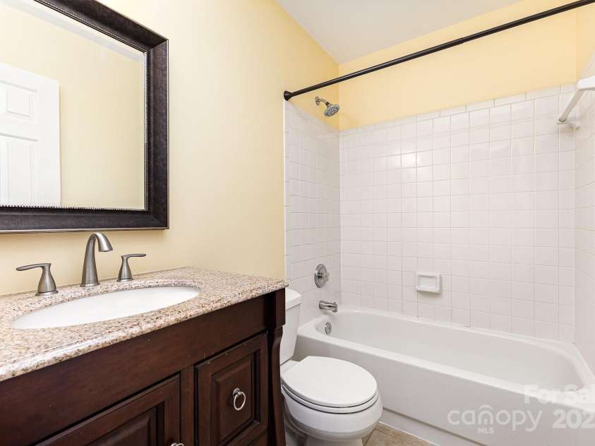 3200 Tallia Court, Charlotte, NC 28269.  MLS# CAR4249625, YatesRealty ID 10032. Guest bath located between the two secondary bedrooms!