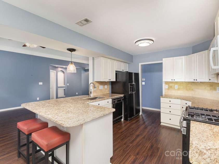 3200 Tallia Court, Charlotte, NC 28269.  MLS# CAR4249625, YatesRealty ID 10032. Spacious kitchen with lots of storage and side by side refrigerator!