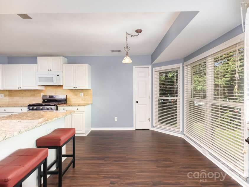 3200 Tallia Court, Charlotte, NC 28269.  MLS# CAR4249625, YatesRealty ID 10032. Sunny breakfast area overlooks backyard!
