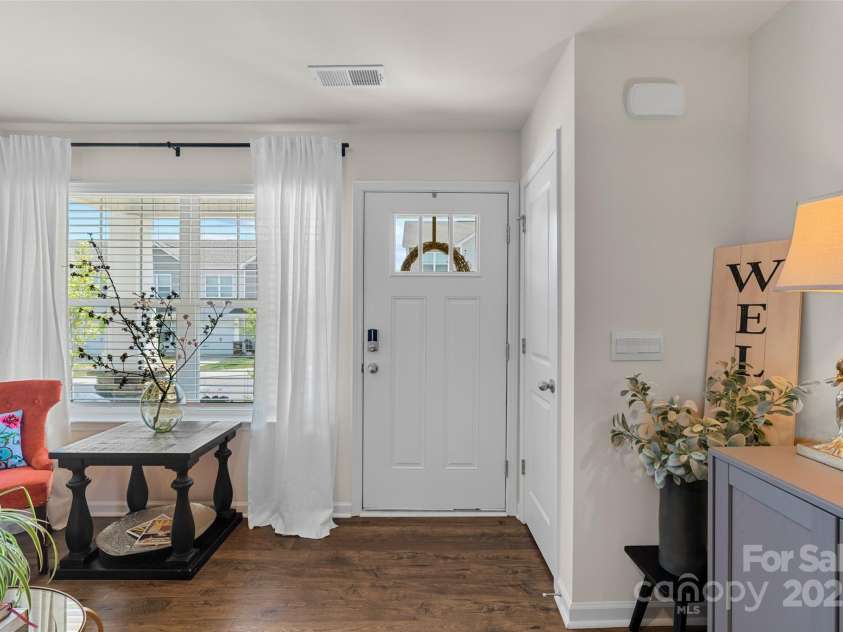 64 Benedict Lane, Weaverville, NC 28787.  MLS# CAR4208936, YatesRealty ID 10032. Inviting front entry with low maintenance laminate flooring