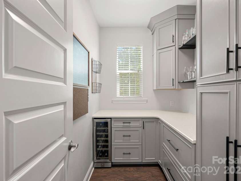 4195 Island Fox Lane, Denver, NC 28037.  MLS# CAR4243299, YatesRealty ID 10051. Custom walk-in pantry with wine fridge.