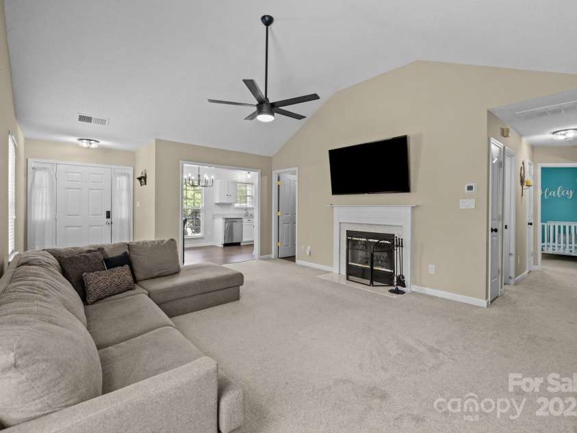 16117 Wrights Ferry Road, Charlotte, NC 28278.  MLS# CAR4251187, YatesRealty ID 10054. Family room opens to dining/kitchen area & hallway to bedrooms