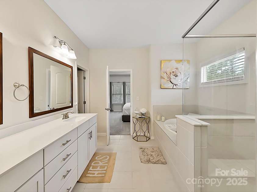 5057 Spratt Road, York, SC 29745.  MLS# CAR4299450, YatesRealty ID 10064. Luxury Owner's bathroom with separate soaking tub and shower