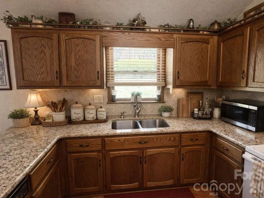 3558 Playmore Beach Road, Lenoir, NC 28645.  MLS# CAR4367215, YatesRealty ID 10067. Kitchen with AI altered decor