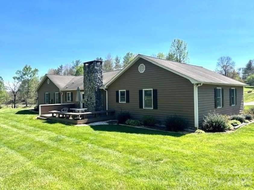 3558 Playmore Beach Road, Lenoir, NC 28645.  MLS# CAR4367215, YatesRealty ID 10067. Rear of the home with patio