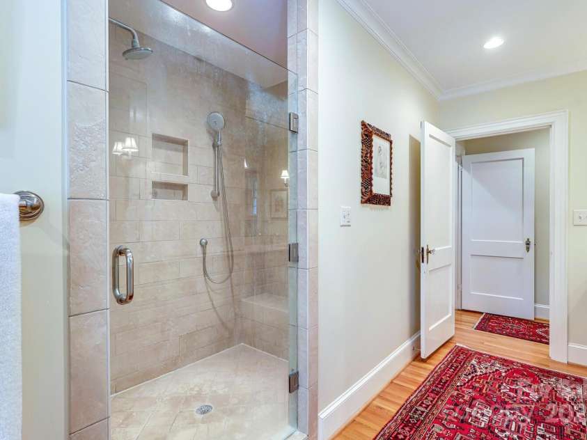 1943 Wendover Road, Charlotte, NC 28211.  MLS# CAR4247717, YatesRealty ID 10072. Primary bathroom with large shower and water closet