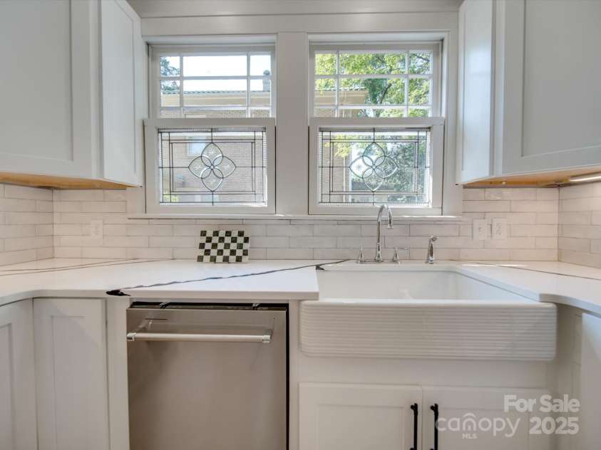 300 Thomas Street, Salisbury, NC 28144.  MLS# CAR4253731, YatesRealty ID 10079. Farm House sink and stained glass windows.