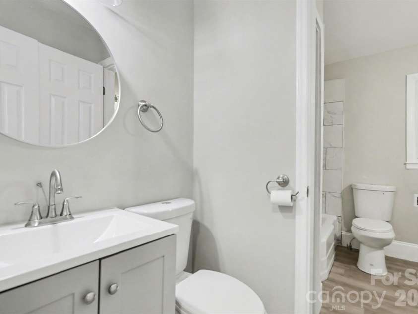 5448 Kinsale Lane, Charlotte, NC 28215.  MLS# CAR4338545, YatesRealty ID 10083. Half bath connected to hallway.
