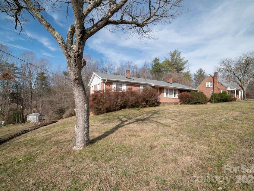 1052 Orchard Street, Valdese, NC 28690.  MLS# CAR4223155, YatesRealty ID 10087. Left side yard