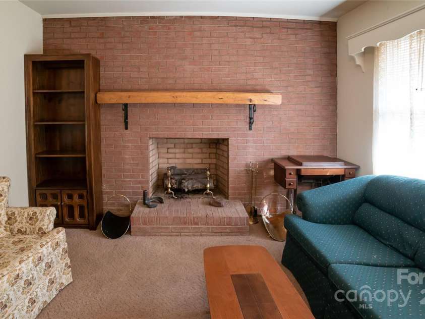 1052 Orchard Street, Valdese, NC 28690.  MLS# CAR4223155, YatesRealty ID 10087. Nice full walled fireplace