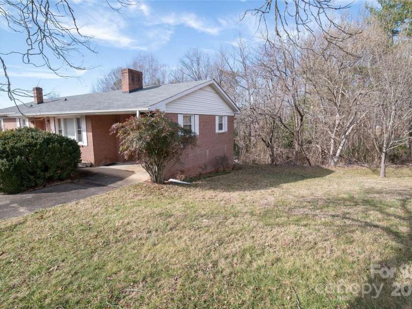 1052 Orchard Street, Valdese, NC 28690.  MLS# CAR4223155, YatesRealty ID 10087. Right side yard