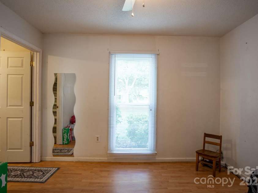 9801 Kent Village Drive, Charlotte, NC 28269.  MLS# CAR4252245, YatesRealty ID 10090. Den/flex space off foyer and kitchen