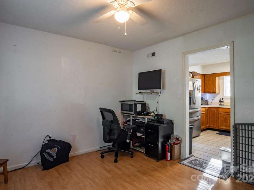9801 Kent Village Drive, Charlotte, NC 28269.  MLS# CAR4252245, YatesRealty ID 10090. Den/flex space off foyer and kitchen