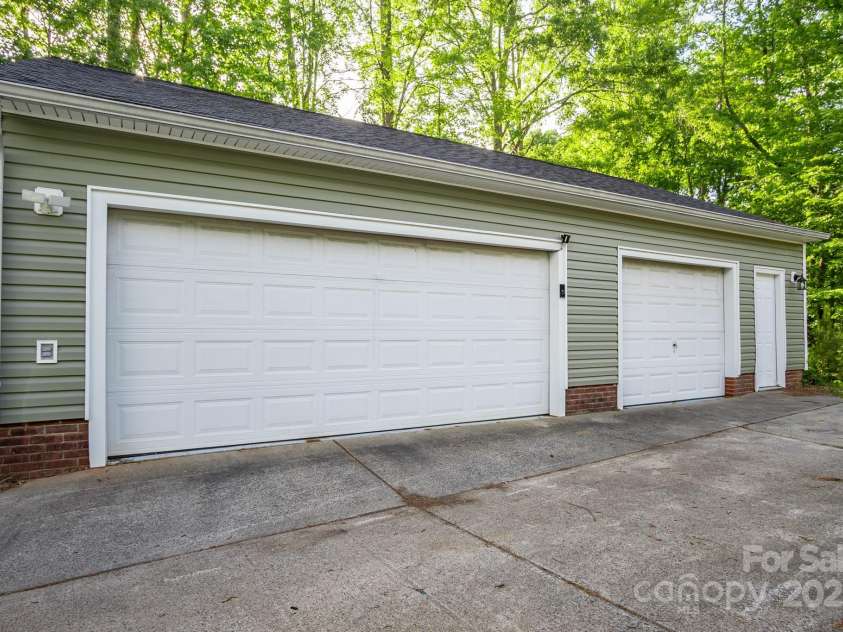 9801 Kent Village Drive, Charlotte, NC 28269.  MLS# CAR4252245, YatesRealty ID 10090. Detached 3-car garage