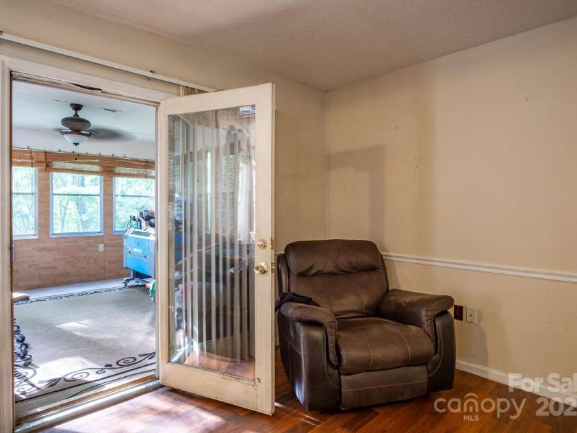 9801 Kent Village Drive, Charlotte, NC 28269.  MLS# CAR4252245, YatesRealty ID 10090. Dining area opens to sunroom
