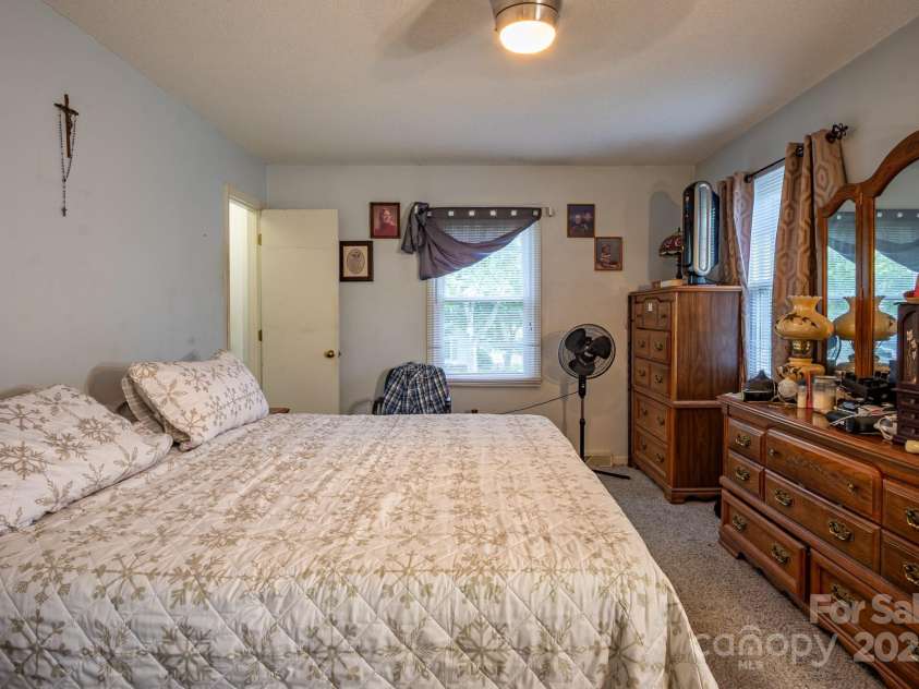 9801 Kent Village Drive, Charlotte, NC 28269.  MLS# CAR4252245, YatesRealty ID 10090. Primary bedroom with two walk-in closets