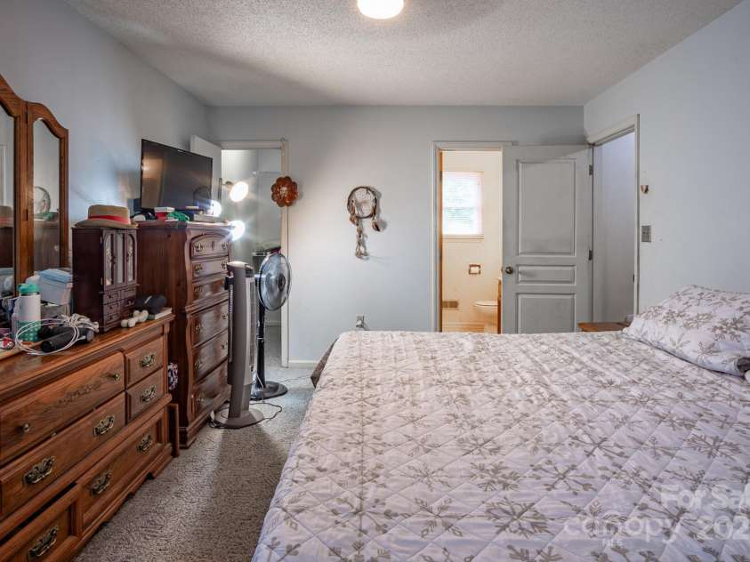 9801 Kent Village Drive, Charlotte, NC 28269.  MLS# CAR4252245, YatesRealty ID 10090. Primary bedroom with two walk-in closets