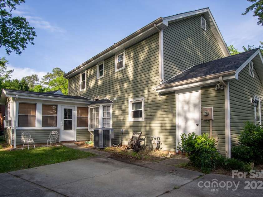 9801 Kent Village Drive, Charlotte, NC 28269.  MLS# CAR4252245, YatesRealty ID 10090. Rear of home