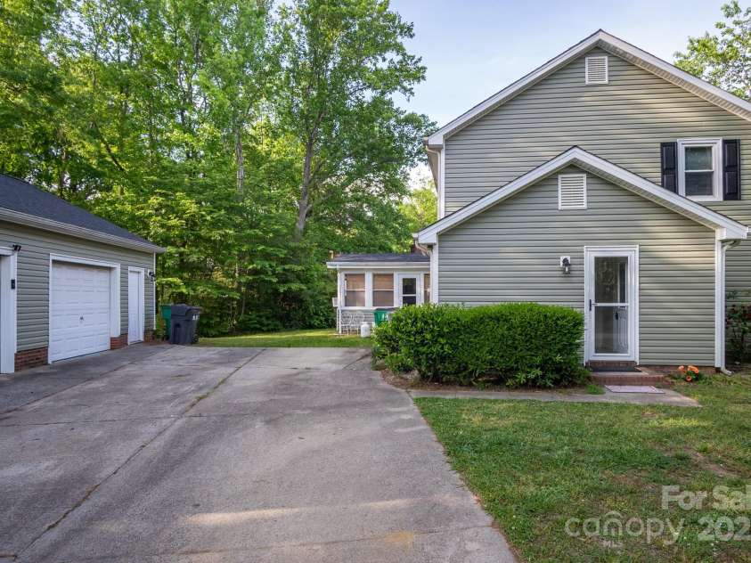 9801 Kent Village Drive, Charlotte, NC 28269.  MLS# CAR4252245, YatesRealty ID 10090. Side entry at driveway