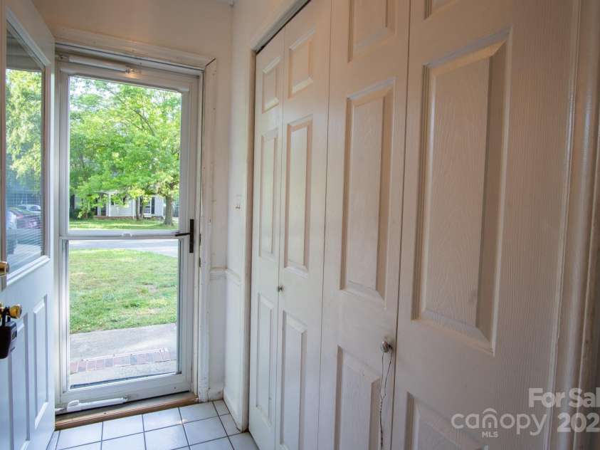9801 Kent Village Drive, Charlotte, NC 28269.  MLS# CAR4252245, YatesRealty ID 10090. Side entry hall with laundry closet