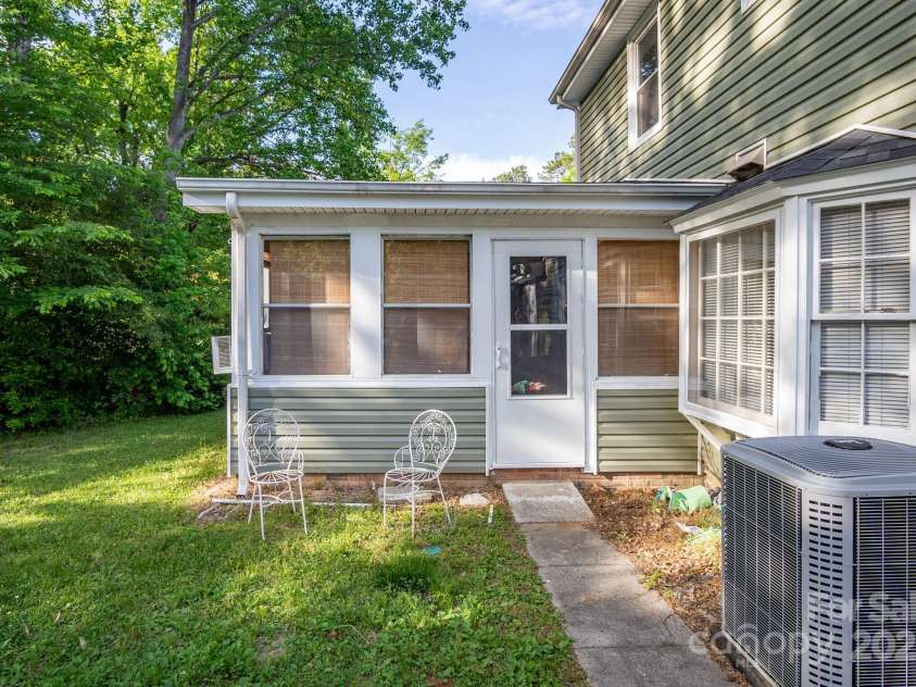 9801 Kent Village Drive, Charlotte, NC 28269.  MLS# CAR4252245, YatesRealty ID 10090. Sunroom entry at rear