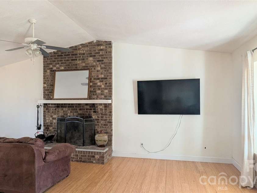 8443 Shiredale Lane, Charlotte, NC 28212.  MLS# CAR4331657, YatesRealty ID 10096. Den with Fireplace