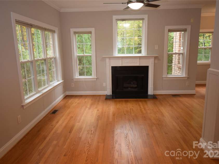 809 Pine Forest Road, Charlotte, NC 28214.  MLS# CAR4203407, YatesRealty ID 10103. Den with gas fireplace