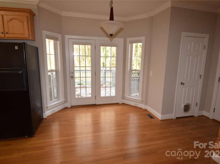 809 Pine Forest Road, Charlotte, NC 28214.  MLS# CAR4203407, YatesRealty ID 10103. Dining area with door to side deck.