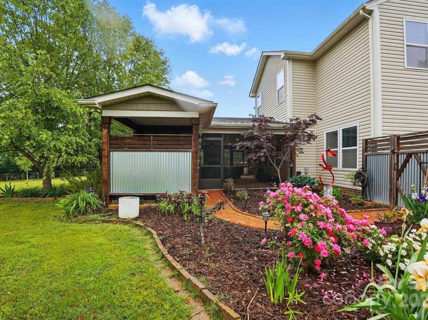 4506 Potter Road, Monroe, NC 28112.  MLS# CAR4251140, YatesRealty ID 10105. Covered Hot tub area with access to the screened porch.