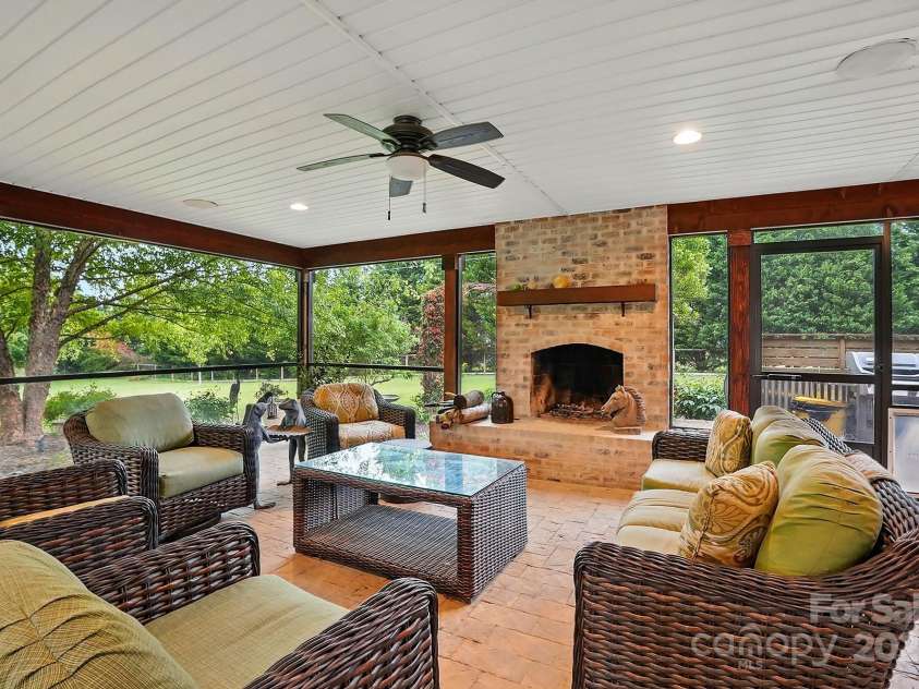 4506 Potter Road, Monroe, NC 28112.  MLS# CAR4251140, YatesRealty ID 10105. Outdoorscreened terrace with wood burning fireplace!