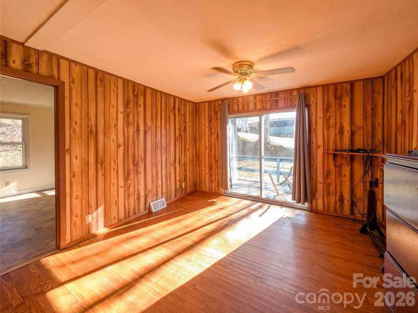 97 Tom Sparks Road, Spruce Pine, NC 28777.  MLS# CAR4335916, YatesRealty ID 10110. Den/flex space with access to small deck and fenced side yard