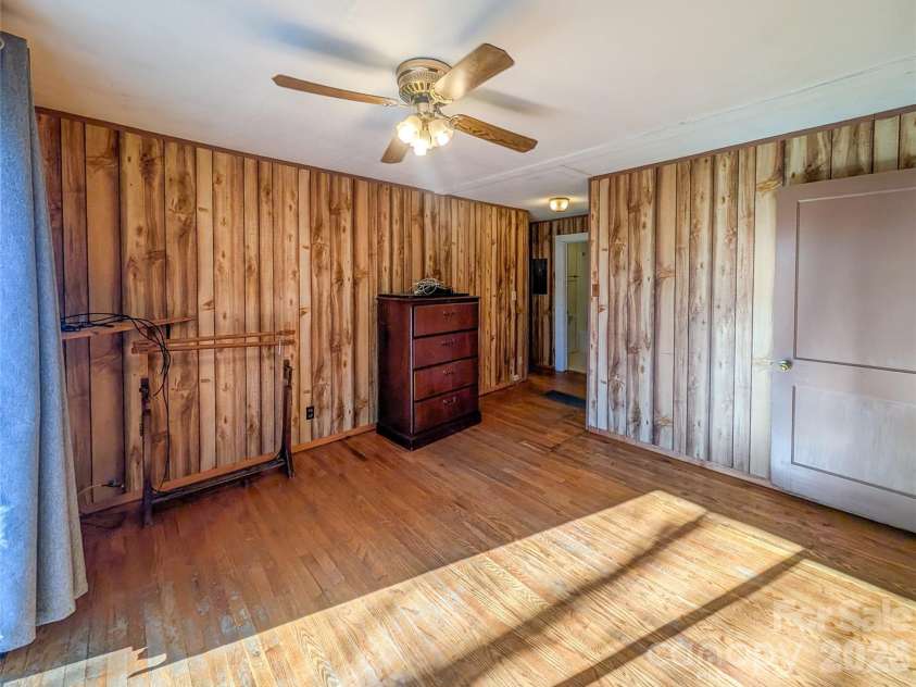 97 Tom Sparks Road, Spruce Pine, NC 28777.  MLS# CAR4335916, YatesRealty ID 10110. Den/flex space with access to small deck and fenced side yard