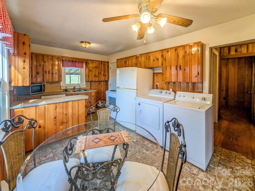 97 Tom Sparks Road, Spruce Pine, NC 28777.  MLS# CAR4335916, YatesRealty ID 10110. Kitchen & Dining Area - washer & dryer 