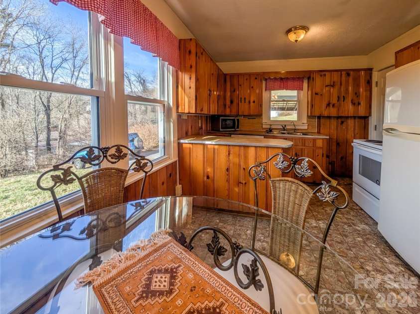 97 Tom Sparks Road, Spruce Pine, NC 28777.  MLS# CAR4335916, YatesRealty ID 10110. Kitchen & Dining Area - washer & dryer 