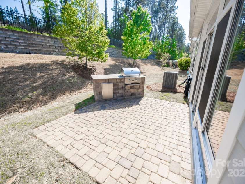 529 Cellini Place, Mount Holly, NC 28120.  MLS# CAR4246421, YatesRealty ID 10114. Paver patio w built-in propane grille