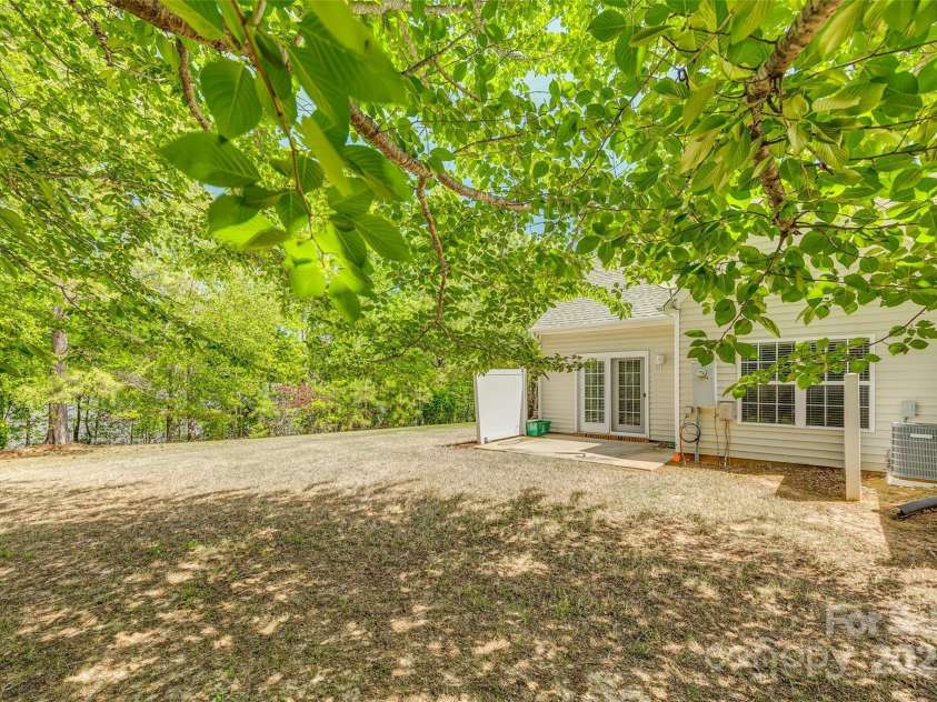 5206 Fire Water Lane, Fort Mill, SC 29707.  MLS# CAR4250029, YatesRealty ID 10118. Large Patio backs up to Green Space
