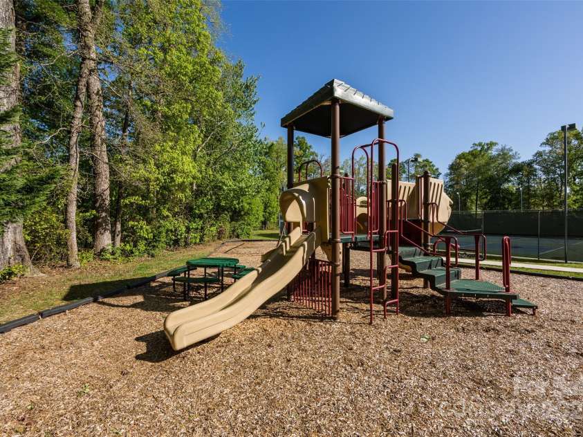 6005 Abergele Lane, Matthews, NC 28104.  MLS# CAR4250164, YatesRealty ID 10119. The Divide Golf Clubhouse